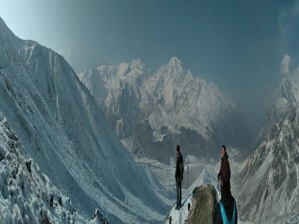 Trekkers admiring the majestic white Himalayas surrounding them in Langtang Valley