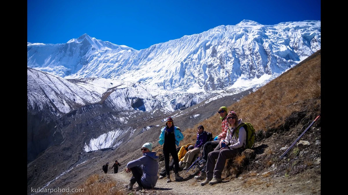 Trekkers resting towards Snowcapped Mountains on Annapurna Circuit Trekking