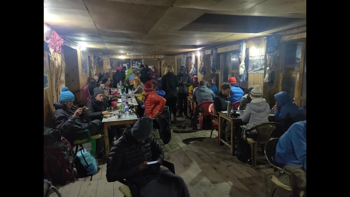 Trekkers enjoying a meal inside a traditional teahouse on the Annapurna Circuit Trek in Nepal