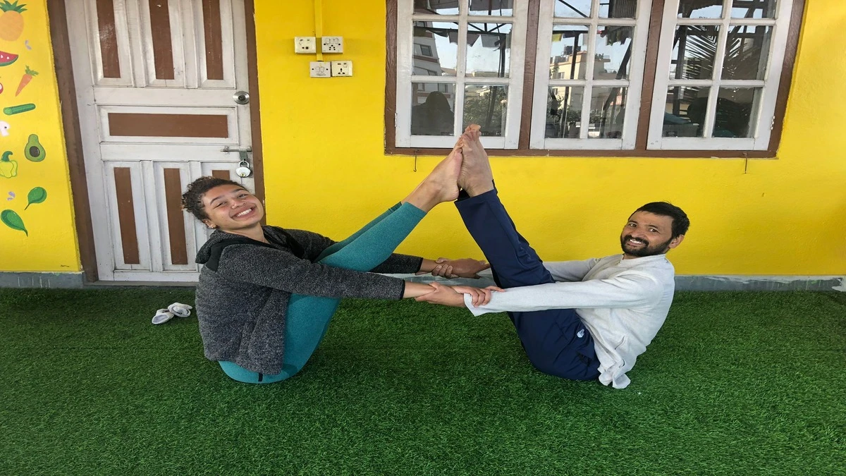 Yoga teacher and student practicing yoga on Mardi Himal Trek yoga and meditation retreat in Nepal