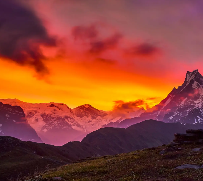 Stunning sunset view from High Camp on the Mardi Himal Trek, with vibrant colors illuminating the Himalayan peaks in Nepal.